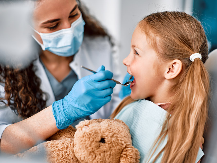 A boy receives dental treatment