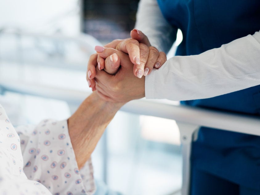 A woman smiling at a health professional