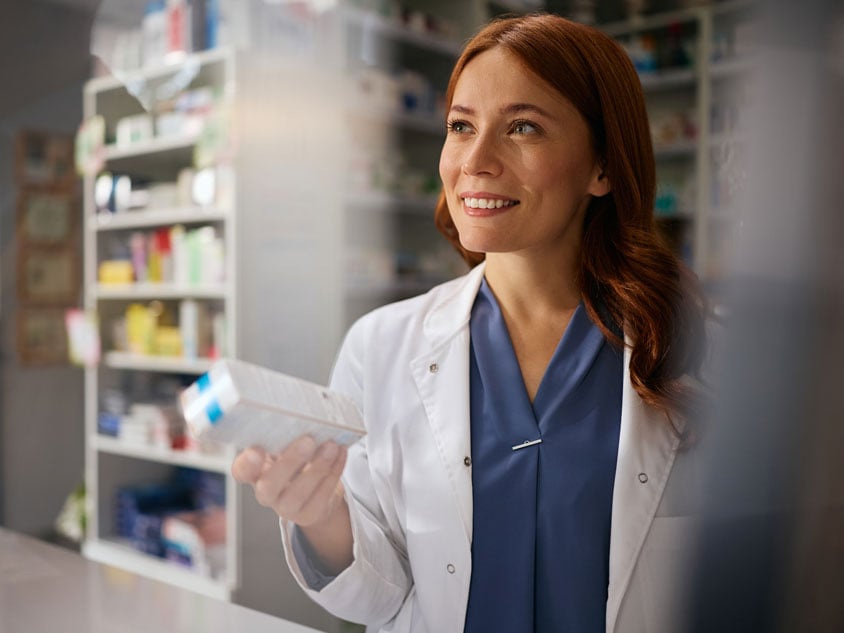 A pharmacist standing